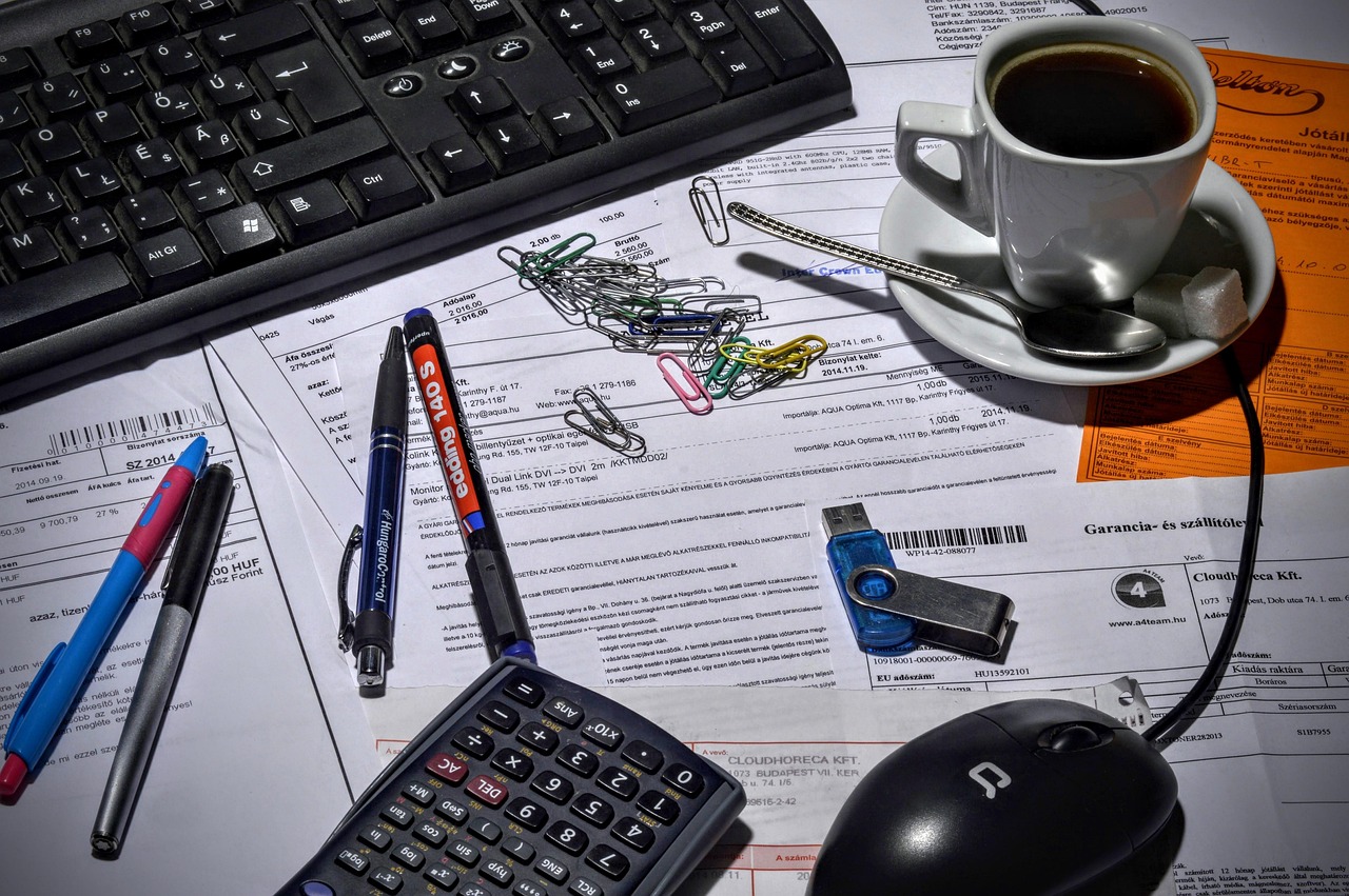 An itemized medical bill being analyzed with a calculator and pen for errors.