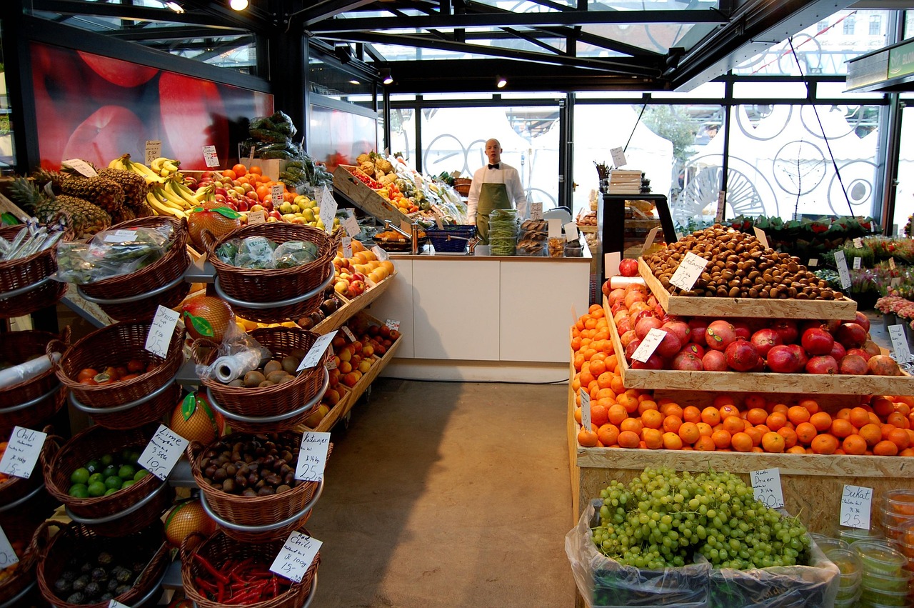 A wicker basket filled with fresh, vibrant organic vegetables and artisanal fruit.