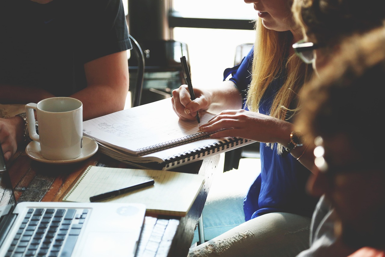A counselor providing guidance to a person during a financial consultation.