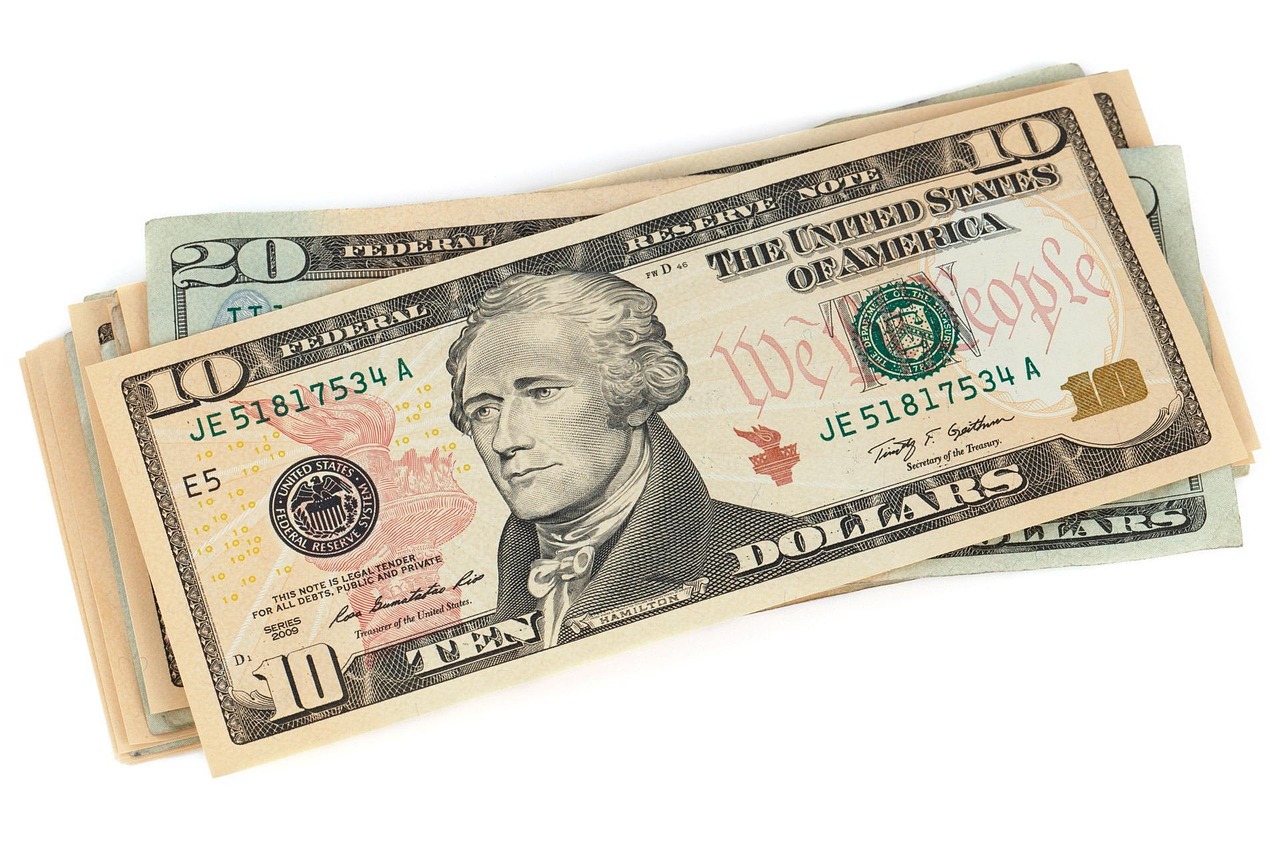Neatly stacked stacks of hundred dollar bills representing a cash reserve.