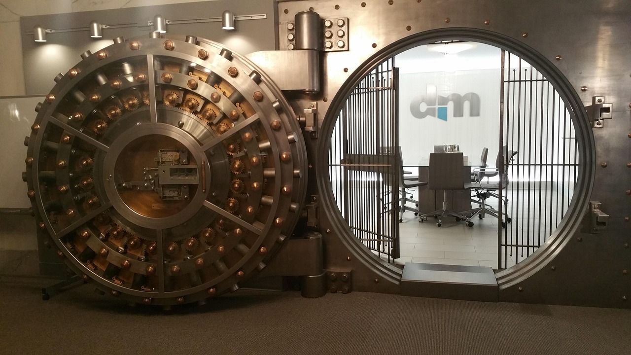 A heavy steel bank vault door representing high-level security and insurance protection.