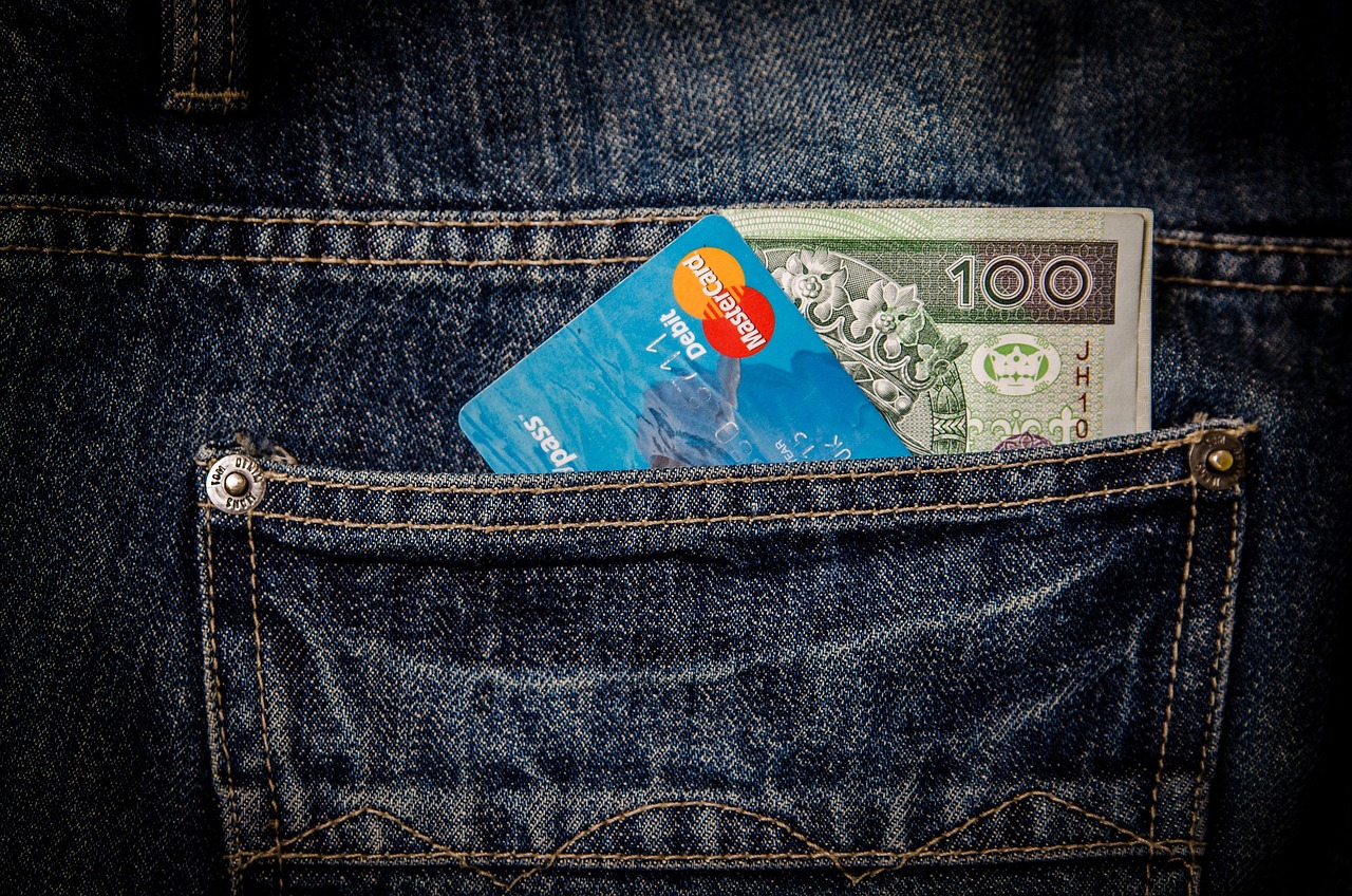 A stack of colorful high-interest credit cards being organized