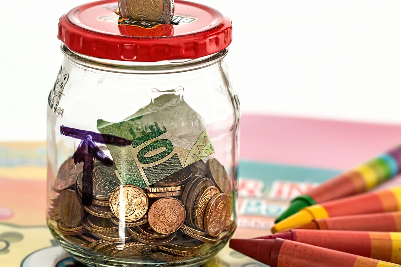Gold coins and a growing plant inside a glass jar, symbolizing portfolio protection.