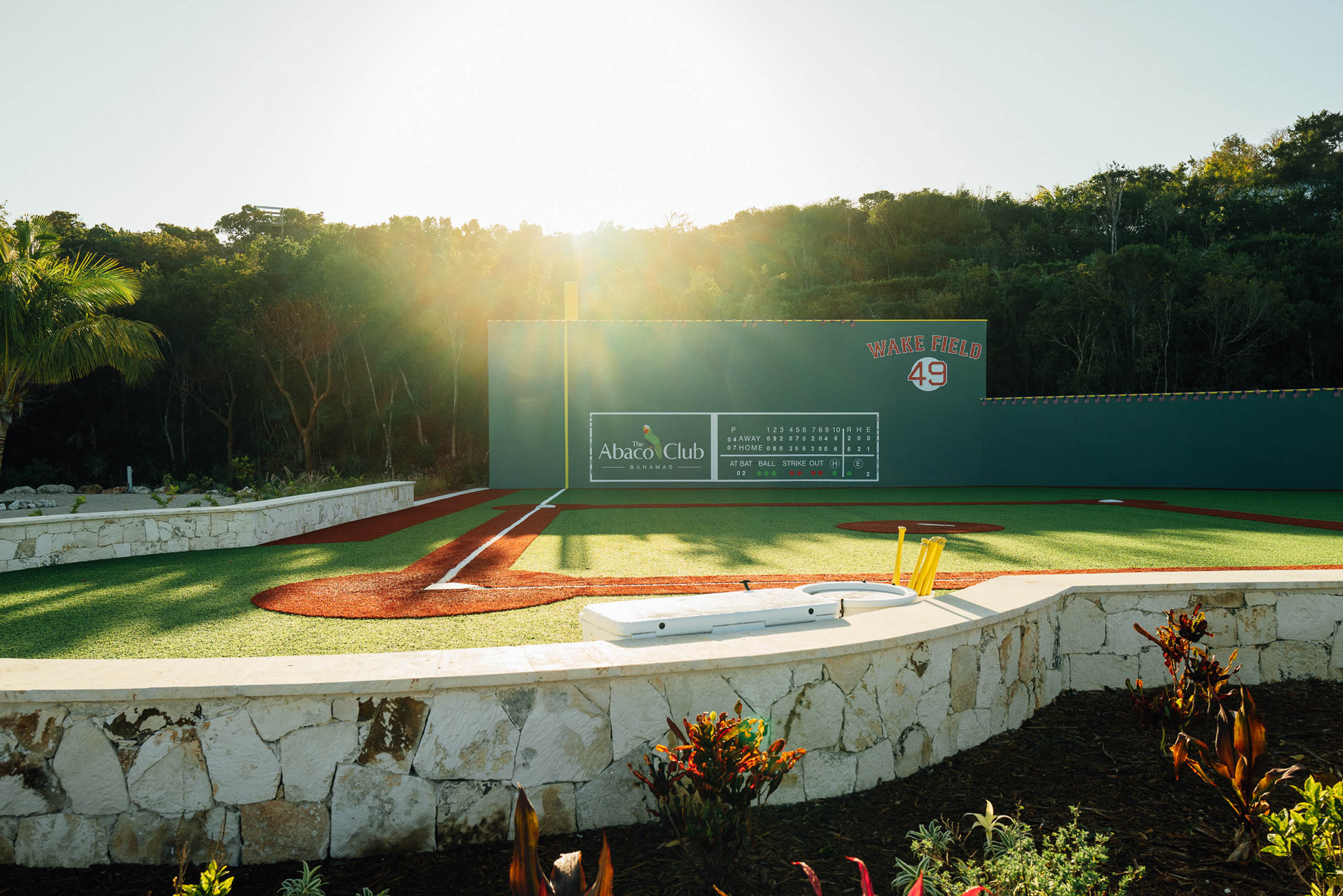 The wiffleball field at The Abaco Club under bright sunlight.