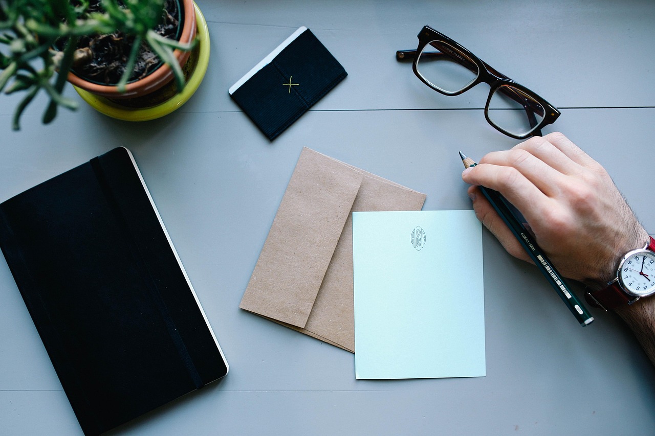 Financial documents on a desk with a magnifying glass, representing a detailed financial review.