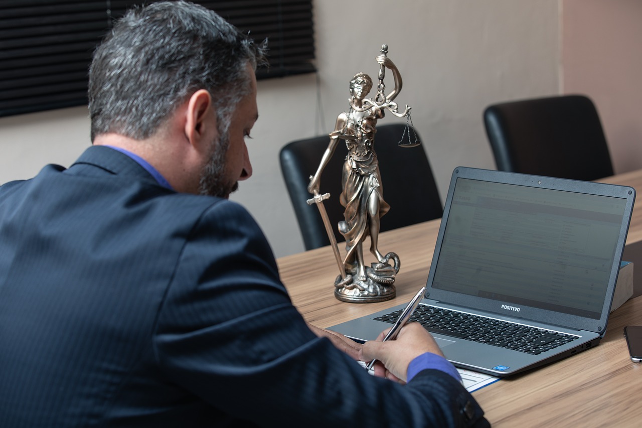 Magnifying glass focusing on small print on a business contract or tax law document.