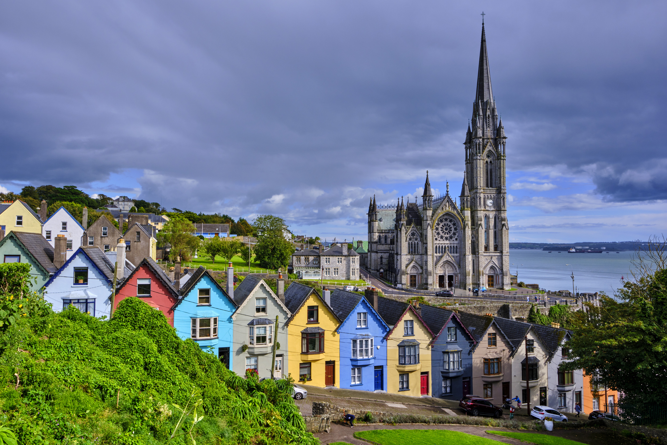 Scenic view of Saint-Colman Cathedral overlooking the port town of Cobh in Ireland.