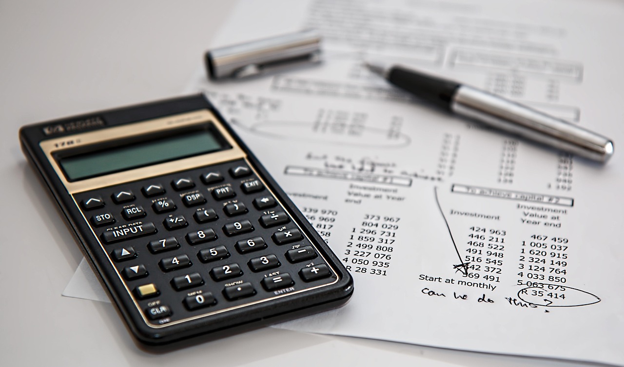 A luxury fountain pen lying on official financial documents and tax forms