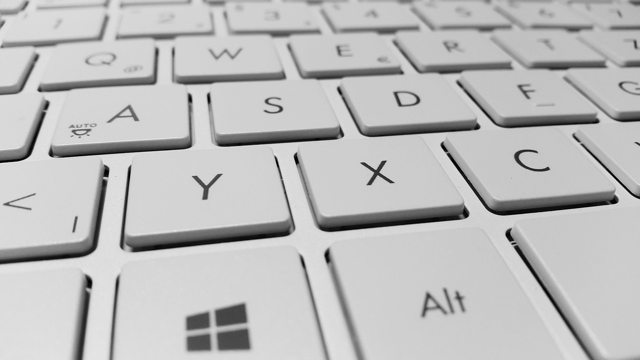 A person using a laptop to search through official online financial databases.