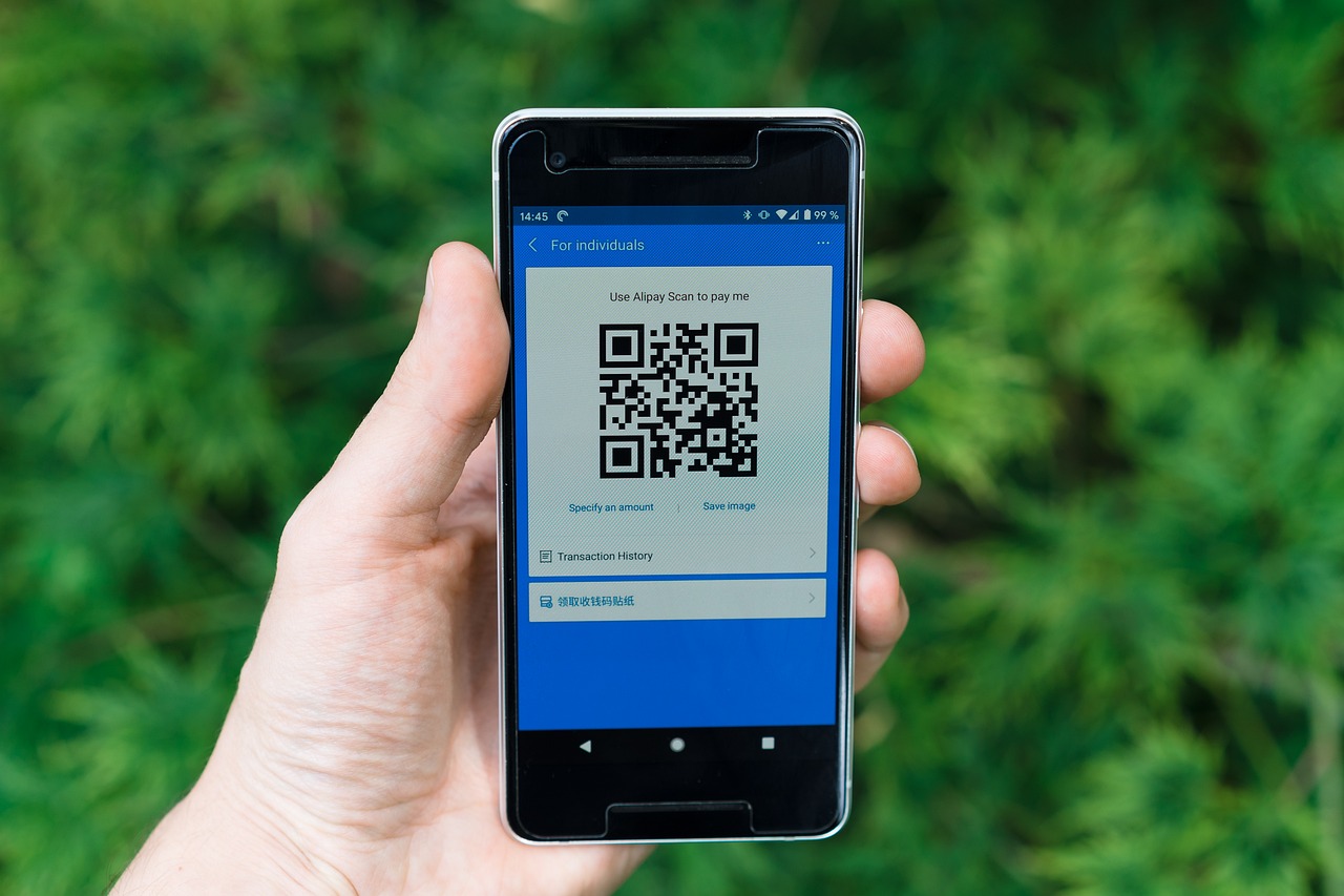A person using a banking application on a smartphone for instant transfers.