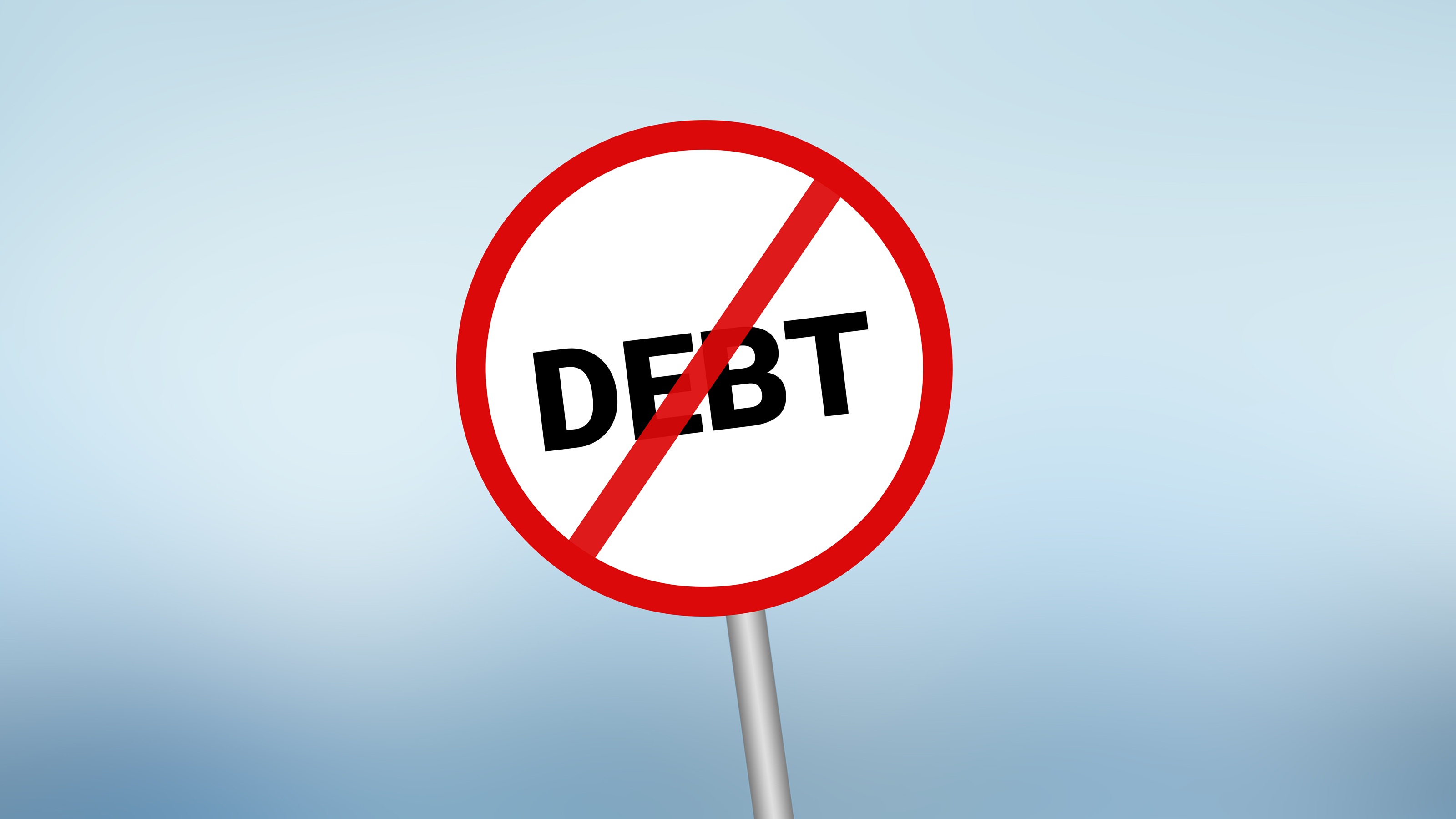 A sign with the word 'debt' crossed out by a red circle and slash.