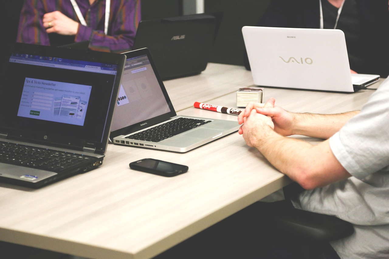 A professional financial advisor discussing options with a client in a modern office setting.