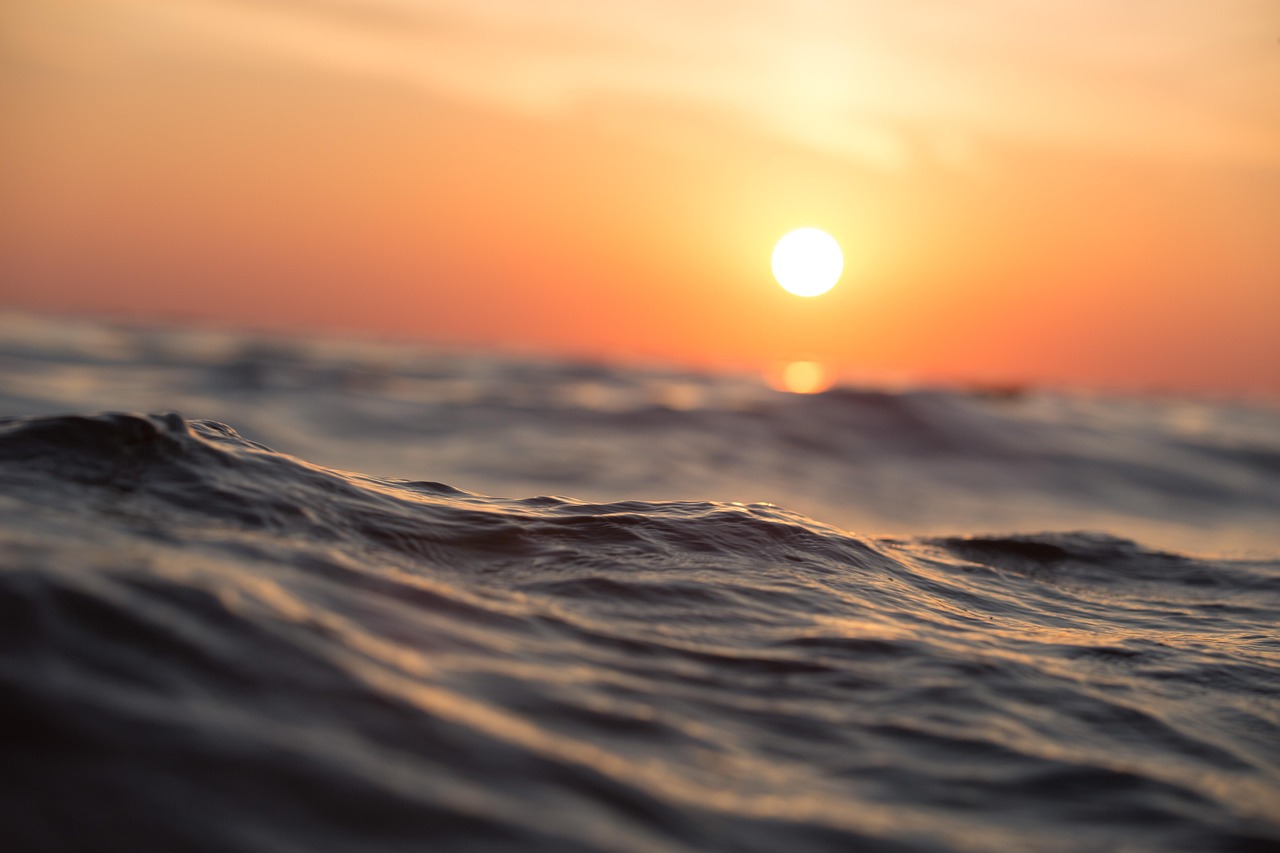 A bright sunrise over an open horizon, symbolizing a clear path to financial independence.