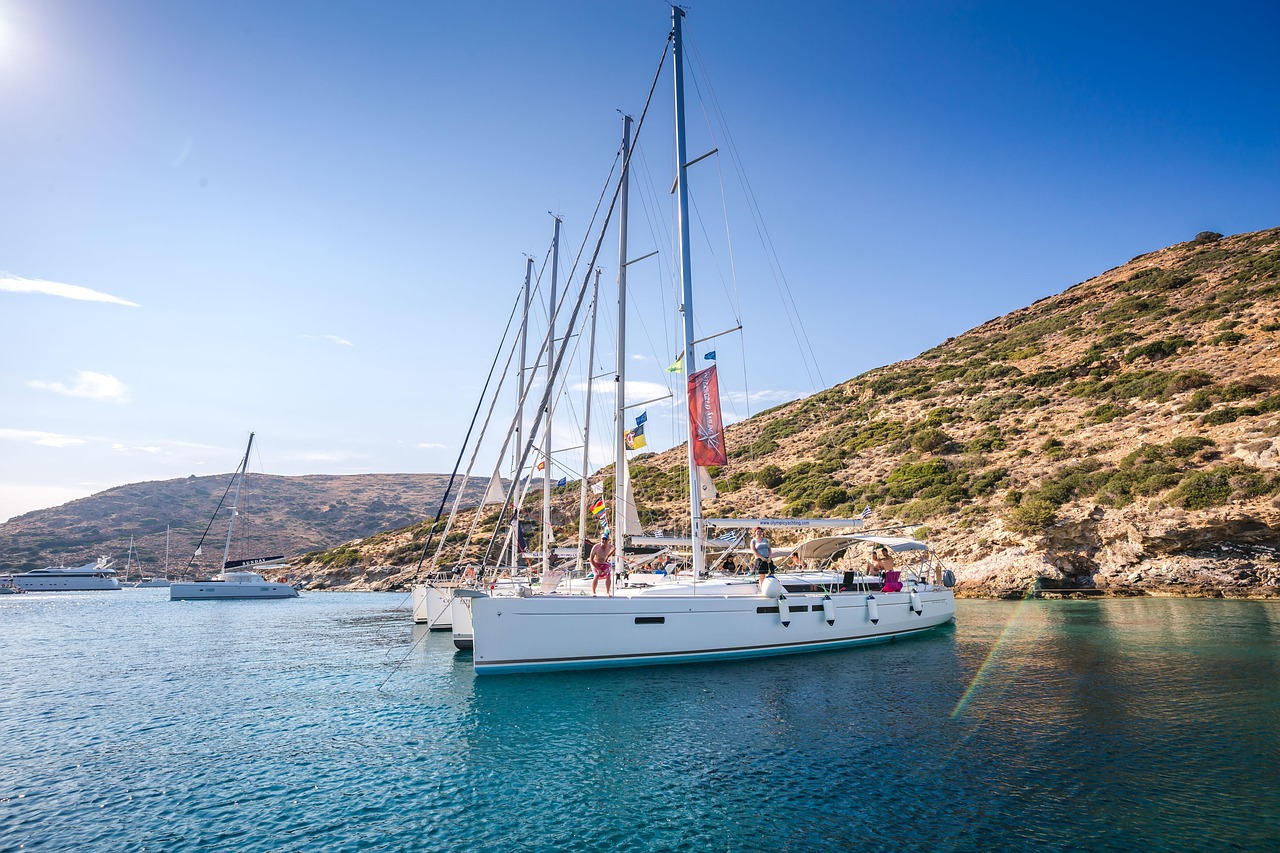 A luxury sailboat on the ocean at sunset representing retirement freedom.