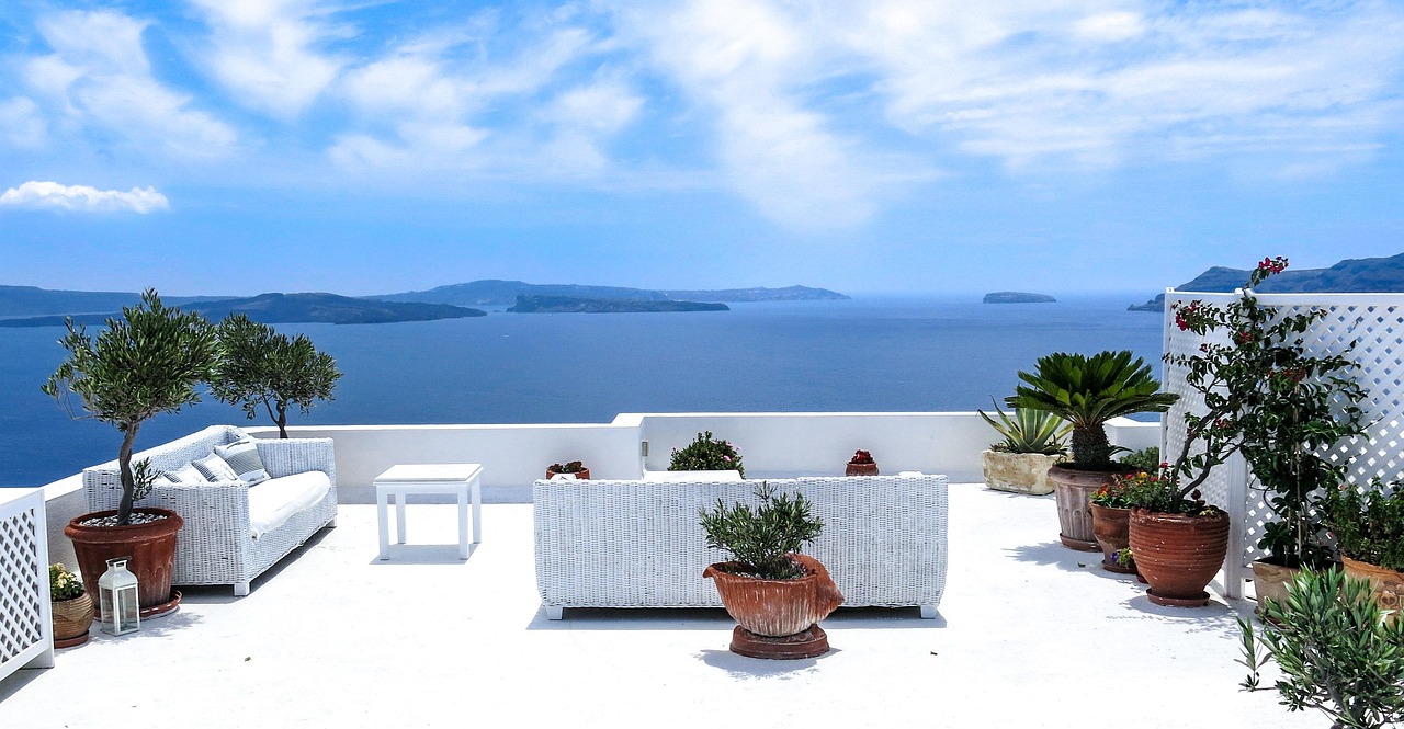 An expansive luxury terrace overlooking the ocean, symbolizing financial freedom