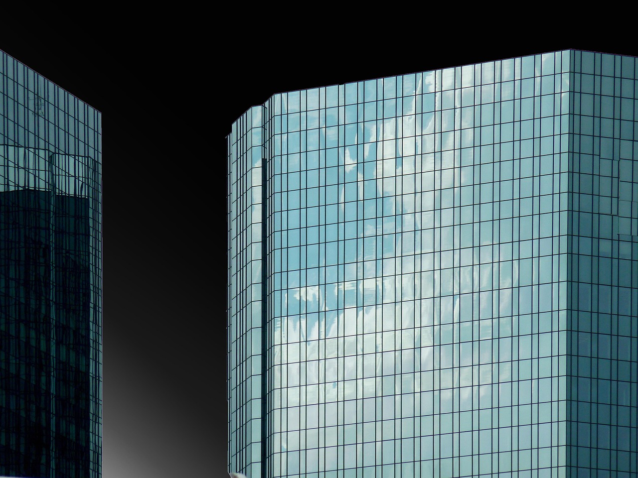 Contemporary glass architecture of a financial institution representing asset-based underwriting.